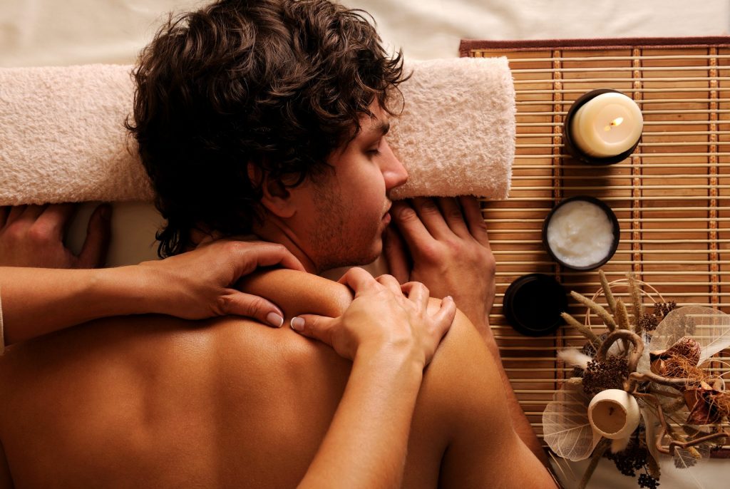 young man spa treatment recreation rest relaxation massage hygh angle view scaled 1 1024x686 1